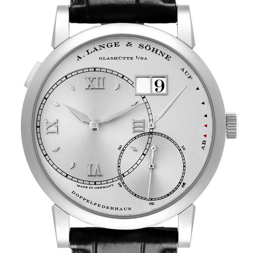 The A. Lange & Sohne Lange 1 115.026 Men's Platinum Silver Dial watch is shown from a front angle, displaying its dial, hands, date, and power reserve indicator.