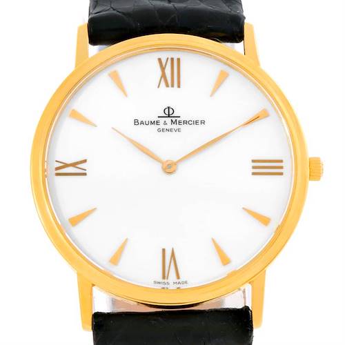 The image shows the front view of a Baume & Mercier Classima MV045088 Men's Yellow Gold White Dial MV045088 Men's Yellow Gold White Dial watch, displaying its dial, hands, and part of the strap.