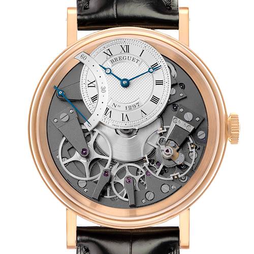 The Breguet Tradition 7097BR/G1/9WU Men's Rose Gold Transparent Dial model watch is shown from the front, highlighting its intricate gears and dial design.