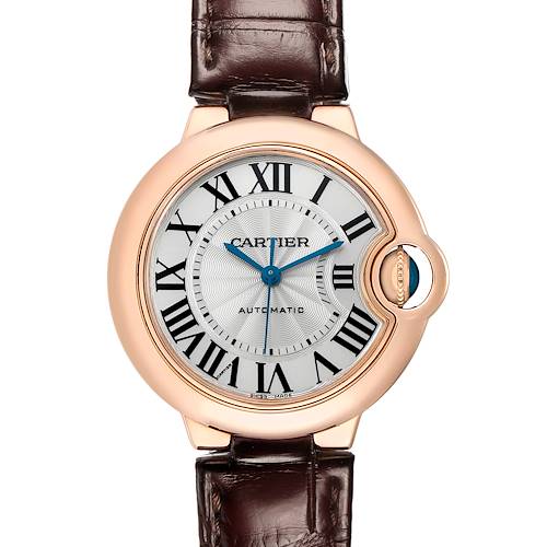 The Cartier Ballon Bleu W6920097 Women's Rose Gold Silver Dial watch is shown from a front angle, displaying the face, Roman numerals, blue hands, and crown.