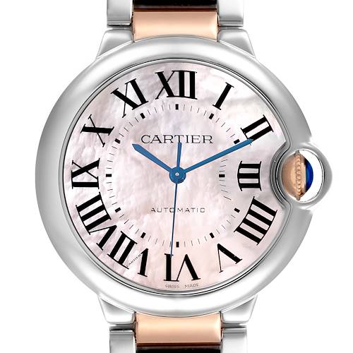 The Cartier Ballon Bleu W6920033 Women's Steel and Gold (two tone) Mother of Pearl Dial W6920033 Women's Steel and Gold (two tone) Mother of Pearl Dial watch is shown in a front view, highlighting the dial, crown, and part of the bracelet.