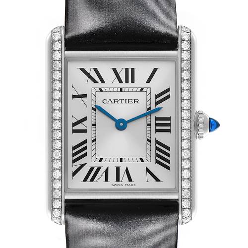 The Cartier Tank Must W4TA0017 Women's Stainless Steel Silver Dial W4TA0017 Women's Stainless Steel Silver Dial watch is shown from a frontal view, displaying the face, diamond-set bezel, and blue cabochon crown.