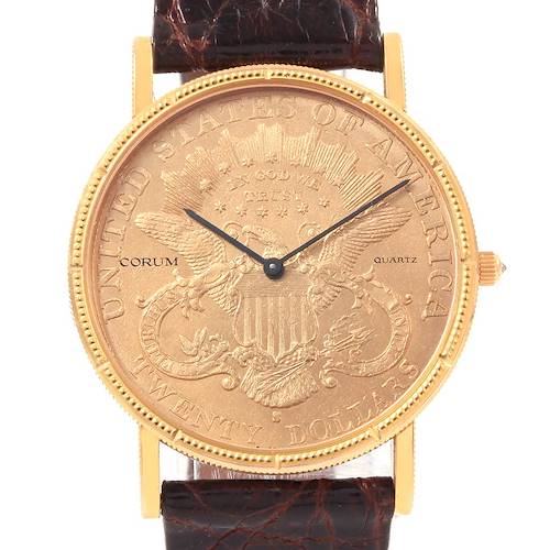 The Corum Coin Watch  Men's Yellow Gold Black Dial  Men's Yellow Gold Black Dial model is shown from a front angle, highlighting its coin-inspired face, gold case, and brown leather strap.