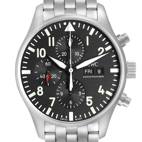 The image shows a frontal view of the IWC Pilot model IW377710 men's watch, featuring its black dial, chronograph subdials, date display, and stainless steel bracelet.