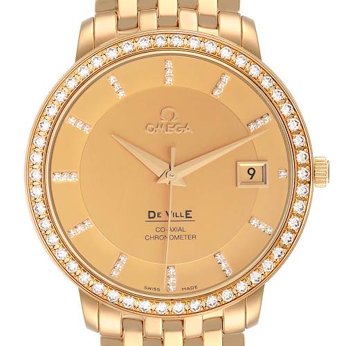 The Omega De Ville 413.58.37.20.58.001 Men's Yellow Gold Champagne Dial watch is shown from a front angle, highlighting the dial, bezel, and part of the bracelet.