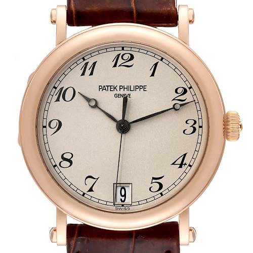 This is a close-up view of the Patek Philippe Calatrava 5053R-001 Men's Rose Gold Beige Dial 5053R-001 Men's Rose Gold Beige Dial watch, showing the dial, hands, case, crown, and part of the leather strap.