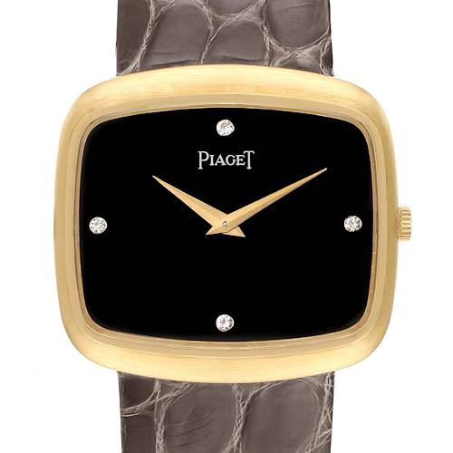 This image shows a front view of the Piaget 9751 Men's Yellow Gold Black Dial 9751 Men's Yellow Gold Black Dial 9751 model, featuring an 18K yellow gold case, black diamond dial, and grey strap.