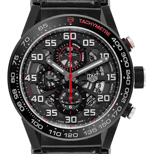 The TAG Heuer Carrera watch is shown from a front angle, highlighting its face, tachymeter bezel, and chronograph subdials.