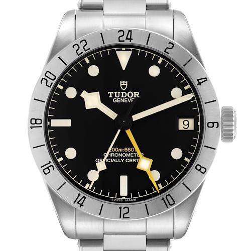 The Tudor Heritage Black Bay 79470 Men's Stainless Steel Black Dial watch is shown from a front angle, displaying the dial, bezel, crown, and part of the bracelet.
