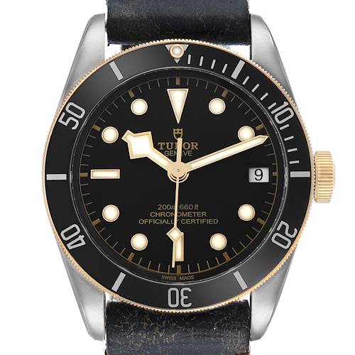 The Tudor Heritage Black Bay 79733 Men's Steel and Gold (two tone) Black Dial watch is shown from the front, featuring the dial, bezel, and crown.