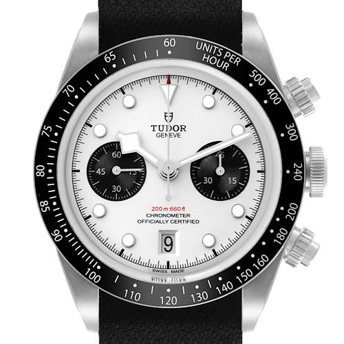 The Tudor Heritage Black Bay watch is shown from a front angle displaying the dial, bezel, and crown.