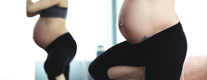 Pregnant woman doing yoga